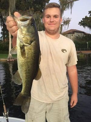 Brandon with a nice Large Mouth Bass he caught on a freshwater trip with CloseEncountersFishing.com