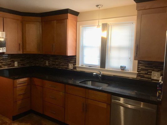 Back splash, counter top and faucet installed