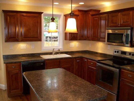 Remodeled Kitchen with Laminate Countertops and Recessed lights