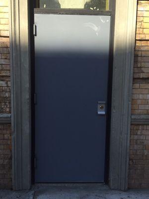 New door installed with panic bar