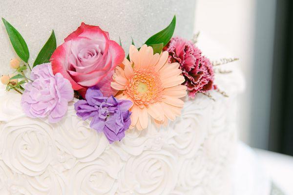 Fresh flowers from the florist combined with the beauty of the cake itself.