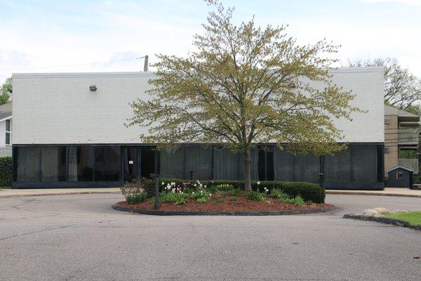 Circle drive (and handicapped parking area). This is the sanctuary-social hall for our Sunday worship. Entrance on left.