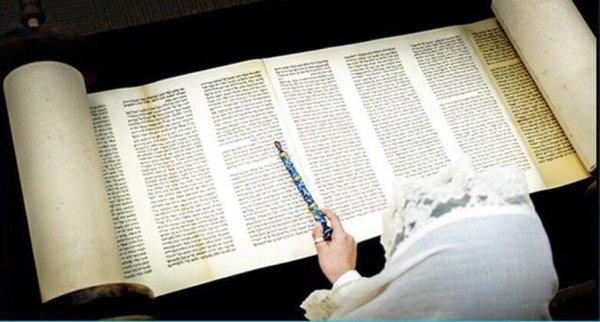 Reading from authentic Torah Scroll