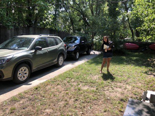 Both of our cars, and a happy customer.