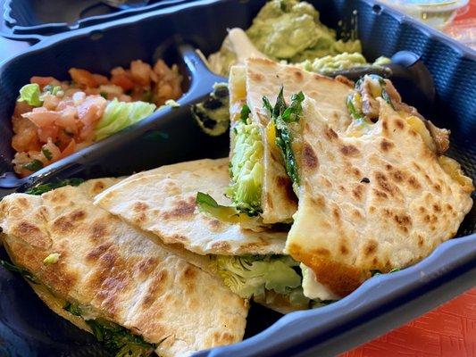 Spinach quesadilla with fresh guacamole and pico de gallo.