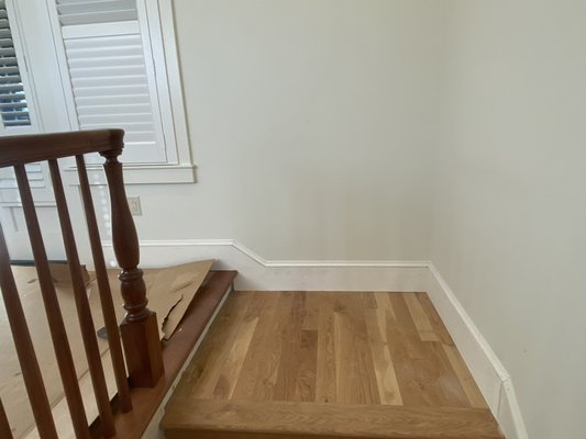 Trimmed out baseboard on stair landing