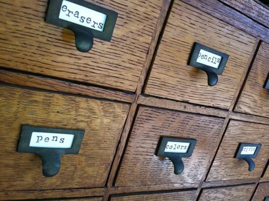 We love this old library card catalogue that holds our office supplies.