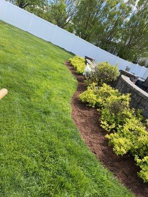 A wonderful edging and mulching job for a fresh looking bed!