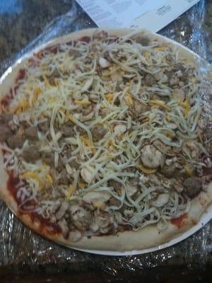 Large thin crust mushroom and sausage $11.35 including tax