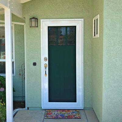 Professional security screen door installation for front door protection in Los Angeles. Viewguard style pictured.