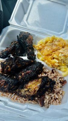 Jerk wings with Mac & cheese and rice & peas