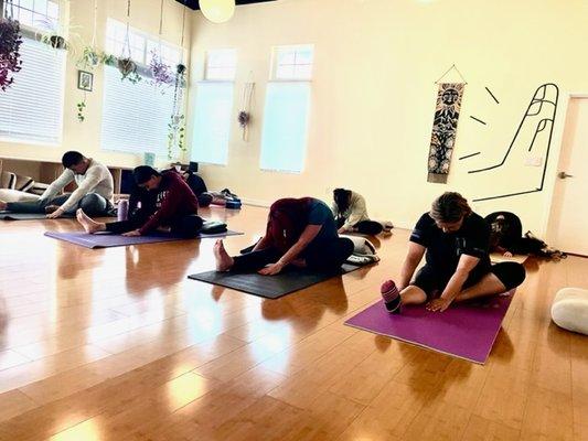 One legged fwd fold in our Wednesday evening Yin class. This stretch is felt in the hamstrings, calves, & side body.