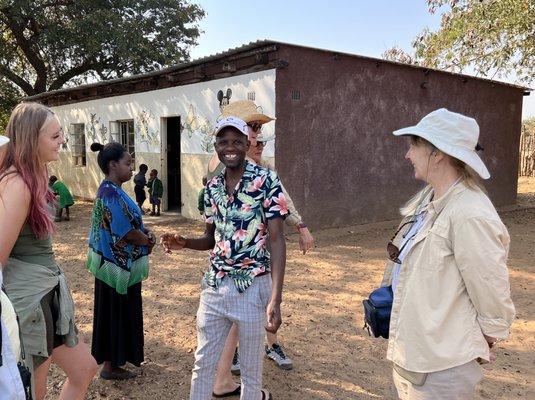 Chatting with teachers and parents of students at a school in Victoria Falls while on my trip through Africa.