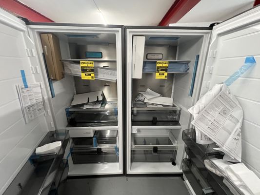 The inside of a Frigidaire professional column freezer on the left fridge on the right