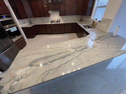 Full kitchen marble installation, backsplash, and floor tile installation result