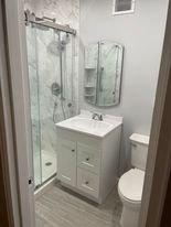 New bathroom with shower stall.