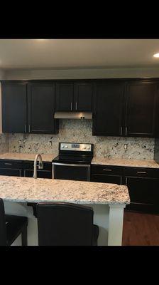 White Ice Granite countertops with full backsplash.