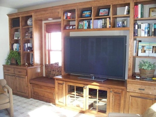 Custom made wall of cabinets for a entertainment area.