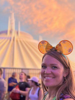 Kellyatthecastle at Disney's Magic Kingdom Tomorrowland in the queue for Tron with Space Mountain in the background.