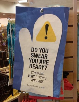 Paper sign covering items including profanity, immediately accessible to kids.