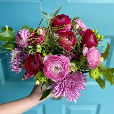 Ridiculously pretty ranunculus with fresh greens