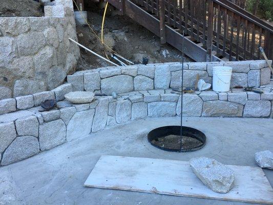 Built a fire pit and rock seating walls.