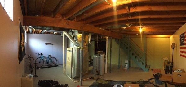 They moved the plumbing and furnace from the center of the room to the back to open up space.