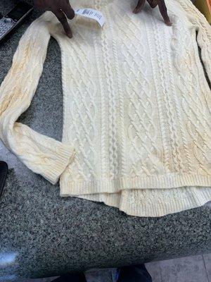 Stains in cashmere sweater damaged by David's Drycleaning