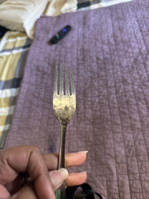 Dirty fork found in cabinet in room