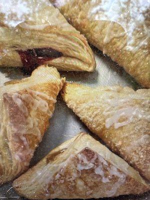 Cherry and apple turnovers made fresh.