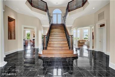 Another view of the open, inviting Grand Oak Stairs at the foyer