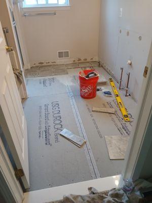 Subfloor that was concrete boarded and started to tile with new 12x12 tiles ceramic