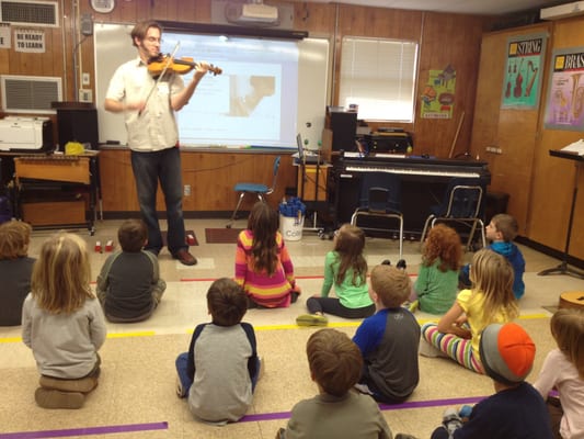 Teaching a class of young musicians.