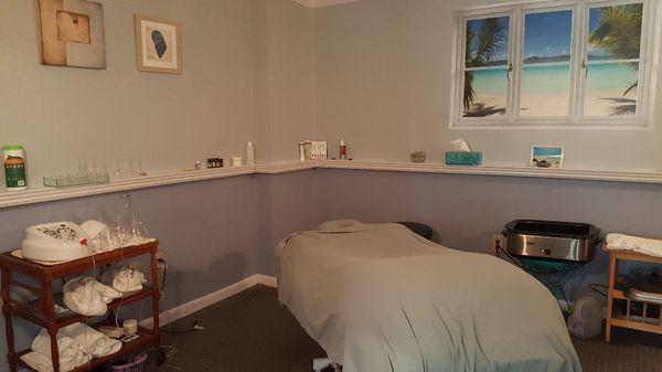 Treatment room with hot stones and cupping