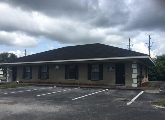 Sammis Law Firm exterior photograph in New Port Richey, FL, across from the West Pasco Judicial Center.