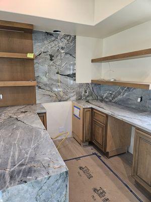 Quartzite kitchen counters and full height splash