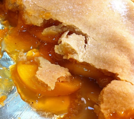 Yummy peach cobbler with a buttery, flaky, crust.