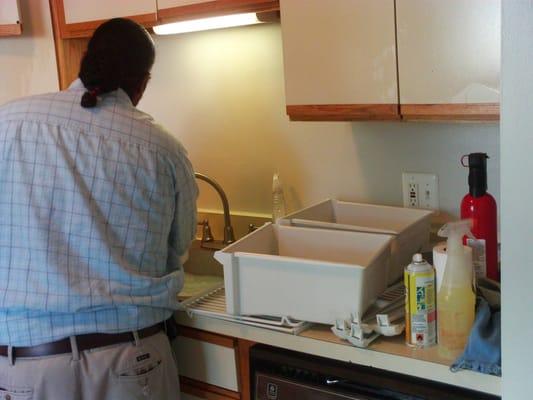 Kitchen being cleaned by one our Classic team members.