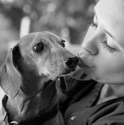 Brittany one of our technicians having a moment with Buddy the Dachshund!