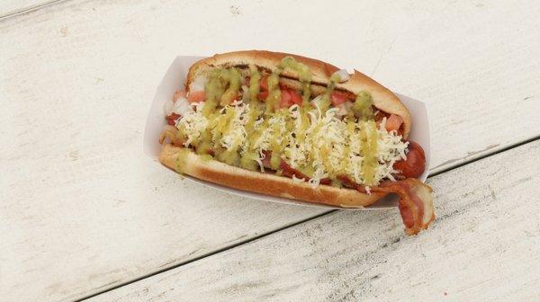 South Waco Dog - Quarter Pound all beef dog loaded with bacon, Pepper Jack cheese, pico de gallo, and topped with tomatillo jalapeño sauce.