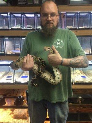 Josh holding a 5ft female Red Tail Boa