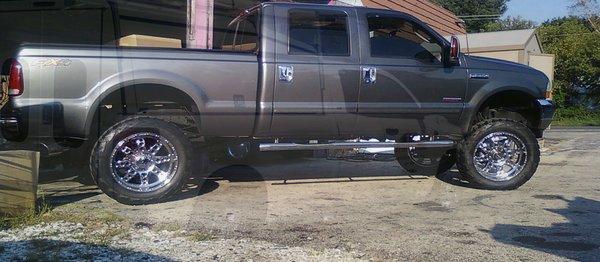 Raptor running boards, stick on vent shades, chrome door handles.