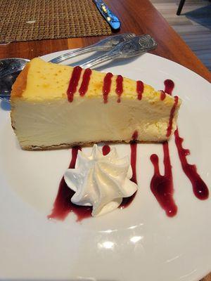 Cheesecake with guava and whipped cream.