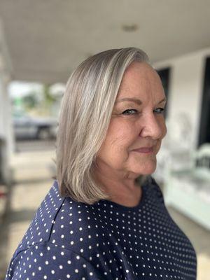 We turned her yellow hair silver to match her new growth and help her grow out her hair!