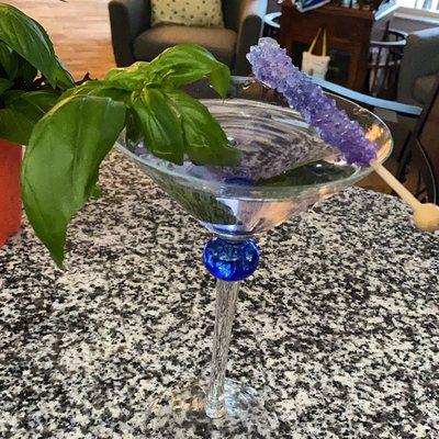 Rock candy isn't just for kids. Try one in your next cocktail. Basil martini with a grape rock candy.