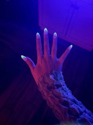 Scary cool glowing green french tips at a Halloween party!