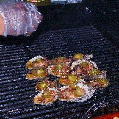 Freshly shucked chargrill oysters top with beacon, jalapeno peppers,