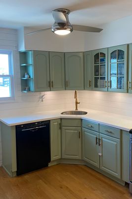 Kitchen refresh. Soffit installation, cabinet repainting, backsplash and window trim replacement