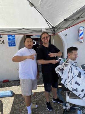 4th of July outside of barbershop providing service during parade, with owner Mark Jackson