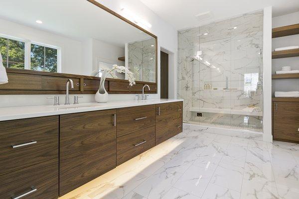 beautiful wooden cabinets with marble shower